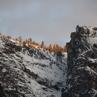 Golden Hour Light on Snow-Covered Mountain Peaks