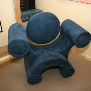 Blue Armchair in Art-Filled Room