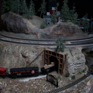 Miniature Train Making Its Way Through a Tunnel