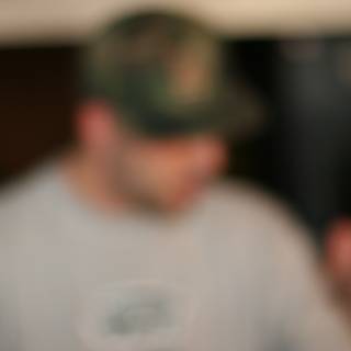 Blurry portrait of a man in a baseball cap