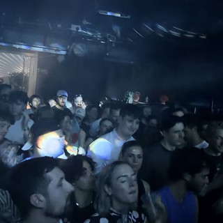 Crowded Underground Club Night with Smoke and Lights