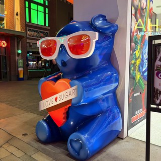 Blue Bear Sculpture with Heart and Sunglasses at Night