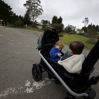 Family Walk on a Cloudy Day with Double Stroller