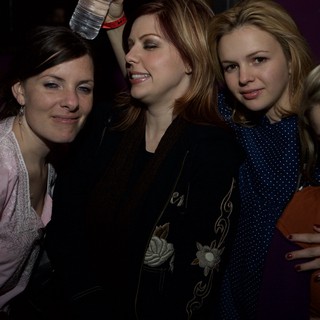 Four Friends Celebrating at a Nightclub Event