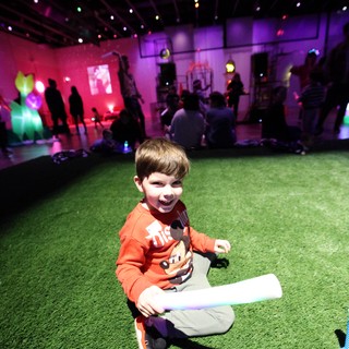 Joyful Child at Baby Rave Interactive Art Experience