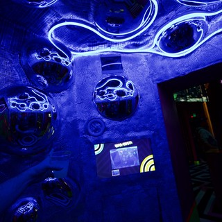 Immersive UV Light Installation with Glowing Tentacles