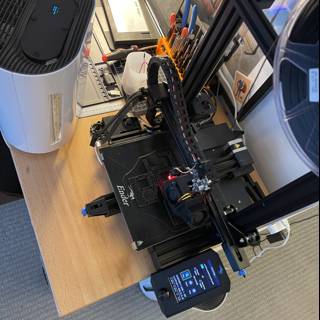 Innovative 3D Printer next to a High-Tech Computer