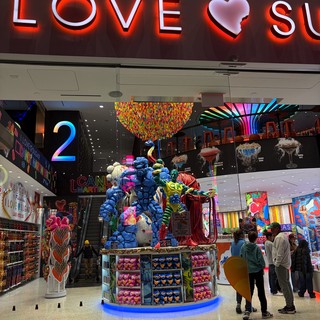 Colorful Candy Store Display with Giant Gummy Bear Sculpture
