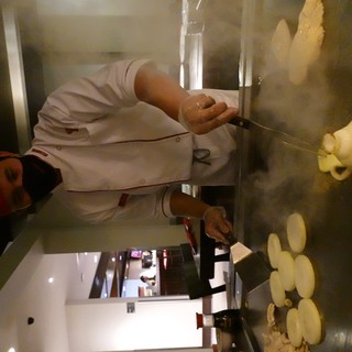 Japanese Teppanyaki Chef Cooking Behind Mask