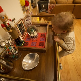 Toddler Discovering Christmas Decorations at Home