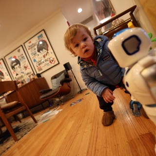 Toddler and Robot Toy in Modern Living Room