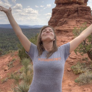 Joyful Woman Embracing Freedom Atop Sedona Red Rocks