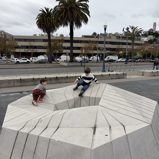 Children Playing on Modern Urban Sculpture Installation