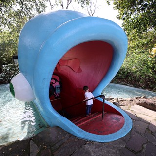 Child Exploring Giant Whale Mouth Playground Structure