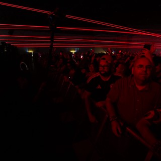 Red Laser Light Show Over Massive Concert Crowd