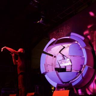 Man on Stage with Futuristic Purple Screen
