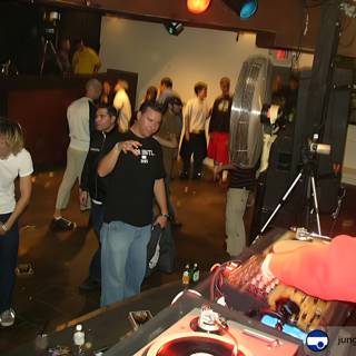 Red Shirt DJ at Night Club