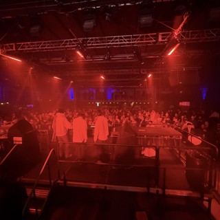 Red-Lit Electronic Music Venue Before Performance