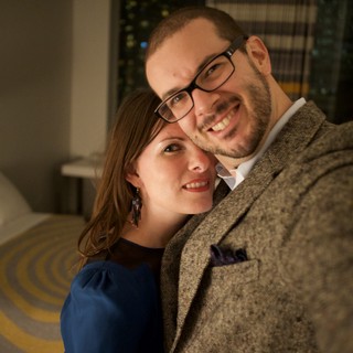 Romantic Couple Selfie in Warmly Lit Hotel Room