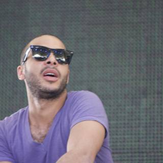Portrait of DJ Mehdi in Sunglasses and Purple Shirt