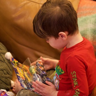 Child Opening Action Figure on Christmas Morning