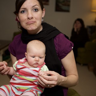 Mother and Baby Share Matching Exasperated Expressions