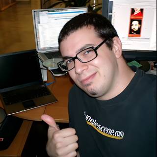 Dave B Gives a Thumbs Up to His Computer