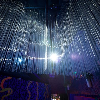 Illuminated Crystal Chandelier Installation in Museum Space