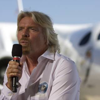 Richard Branson Addressing the Crowd in Front of White Knight Two