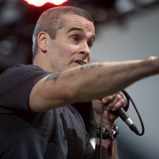 Henry Rollins takes the stage with a microphone at Coachella 2009