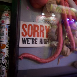 Humorous 'Sorry We're High' Sign with Inflatable Display