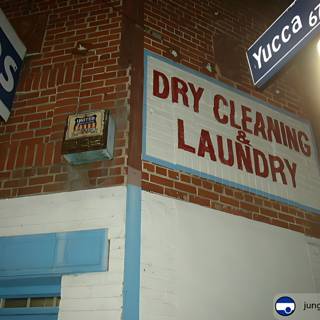 Dry Cleaning Sign on Brick Building