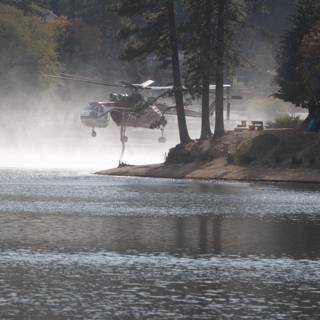 Helicopter Assists Fire Truck Near Lake