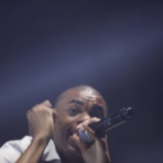 Vince Staples Takes the Stage with Microphone in Hand