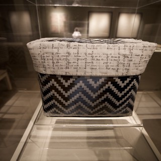Traditional Woven Basket with Chevron Pattern in Museum Display
