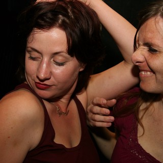 Two Women Dancing Together at Nightclub Party