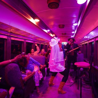 Live Music Performance on Illuminated Train Car