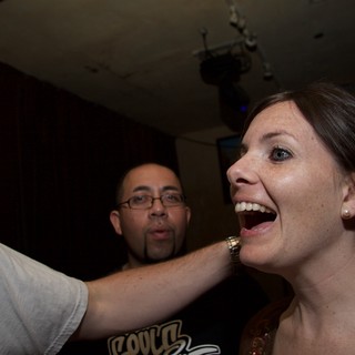 Laughing Woman Surprised at Art Walk Party