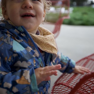 Joyful Toddler at Outdoor Playground on Winter Day