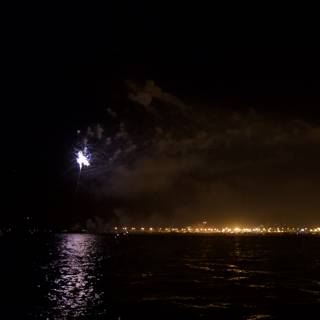 Awe-inspiring Fireworks Show Over the Glistening Water