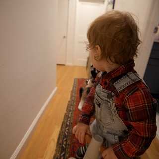 Toddler on Toy Horse in Hallway