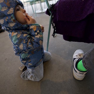 Toddler in Cloud-Print Jacket at Playground