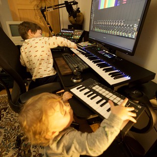 Young Brothers Making Music Together in Home Studio