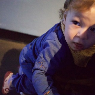 Curious Toddler in Blue Pajamas Close-Up Portrait