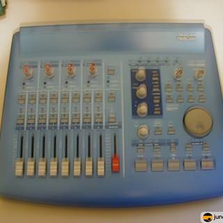 Blue Mixer with Various Knobs and Buttons