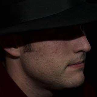 Mysterious Man in Black Hat