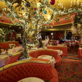 Lavishly Decorated Christmas Restaurant with Ornate Tree Display