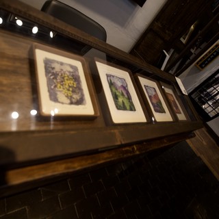 Illuminated Gallery Wall Display in Contemporary Restaurant