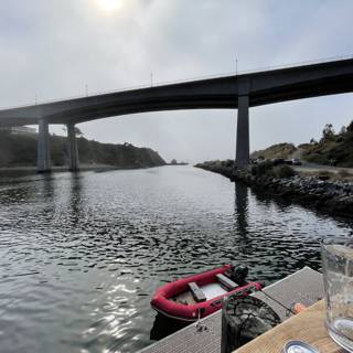 Docked Boat with Ocean View under Bridge