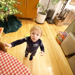 Toddler Reaching Out on Christmas Morning